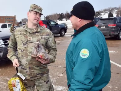 Offutt Giving Thanks military person receiving hams